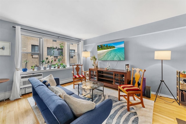 120 E Hartsdale Unit 3L, Hartsdale, NY 10530 - living area with wood finished floors, a baseboard heating unit, baseboards, and an AC wall unit