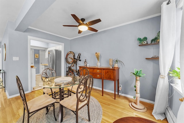 120 E Hartsdale Unit 3L, Hartsdale, NY 10530 - dining room featuring baseboard heating, a ceiling fan, light wood-style floors, baseboards, and ornamental molding