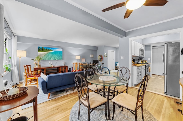120 E Hartsdale Unit 3L, Hartsdale, NY 10530 - dining space featuring light wood-type flooring, a ceiling fan, and ornamental molding