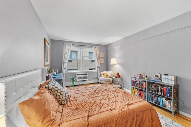 120 E Hartsdale Unit 3L, Hartsdale, NY 10530 - bedroom with a baseboard radiator, wood finished floors, and baseboards