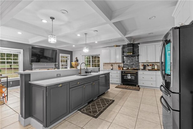 2 Fieldstone Ct, Highland, NY 12528 - kitchen with appliances with stainless steel finishes, a sink, white cabinets, light countertops, and coffered ceiling