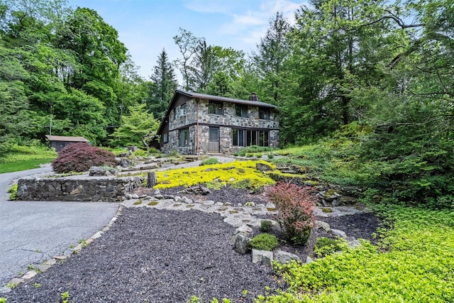 1670 Baptist Church Rd, Yorktown Heights, NY 10598 - view of front facade with stone siding and a chimney