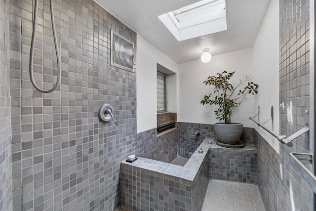 1670 Baptist Church Rd, Yorktown Heights, NY 10598 - bathroom with tile walls, a skylight, and a tile shower