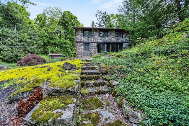 1670 Baptist Church Rd, Yorktown Heights, NY 10598 - rear view of property featuring stone siding and a chimney