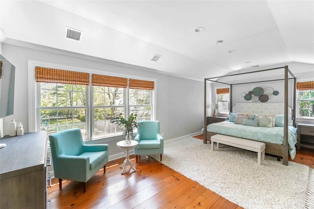 39A Foster Rd, Quogue, NY 11959 - bedroom with wood-type flooring, lofted ceiling, baseboards, and ornamental molding