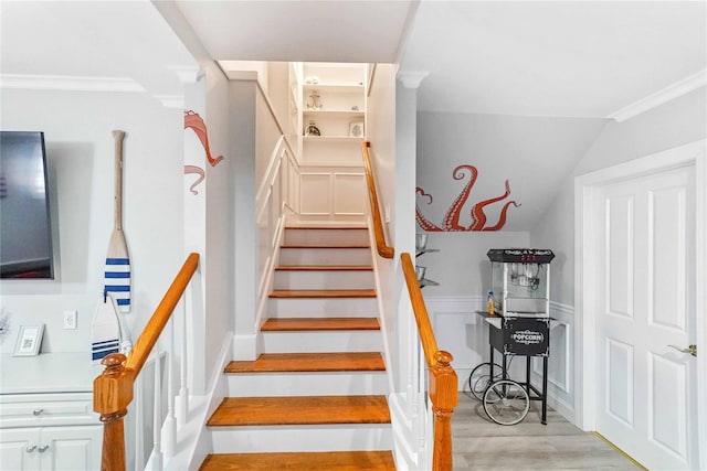 39A Foster Rd, Quogue, NY 11959 - staircase with wood finished floors, crown molding, and vaulted ceiling