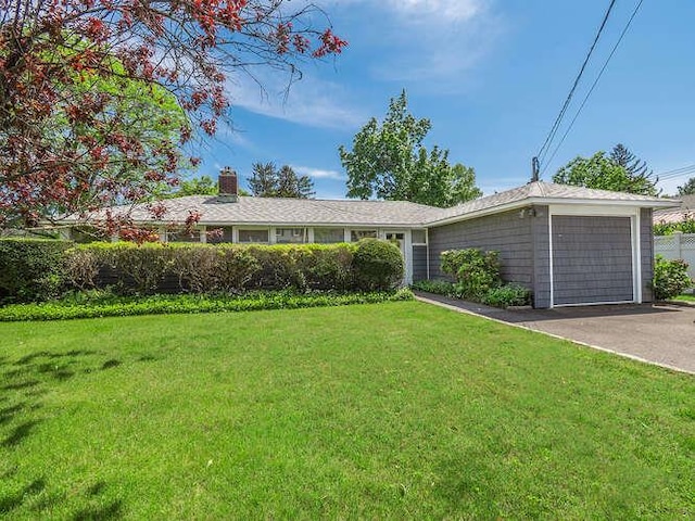 31 Townsend St, Glen Head, NY 11545 - single story home with a front yard, a chimney, driveway, and an attached garage
