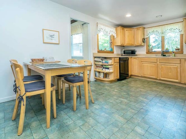 31 Townsend St, Glen Head, NY 11545 - kitchen with light brown cabinets, stainless steel microwave, light countertops, healthy amount of natural light, and recessed lighting