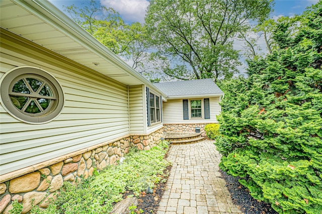 1 Idle Day Dr, Centerport, NY 11721 - doorway to property with stone siding and a shingled roof