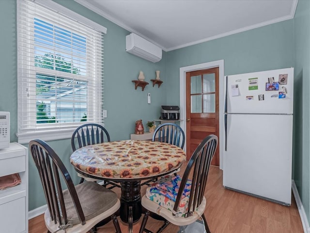 1311 154th St, Beechhurst, NY 11357 - dining space featuring a wall mounted air conditioner, healthy amount of natural light, light wood-style flooring, and crown molding