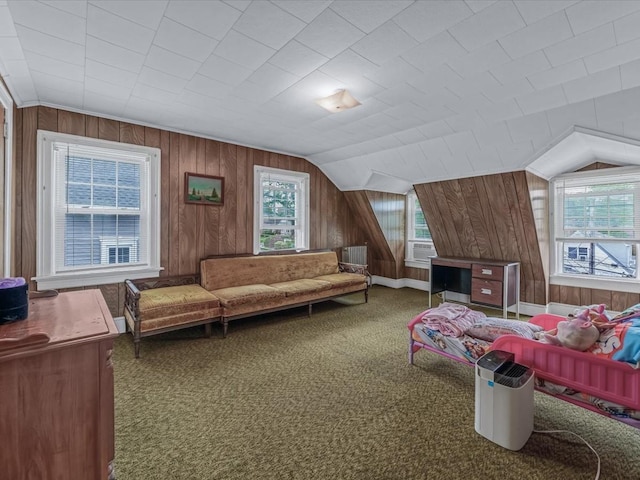 1311 154th St, Beechhurst, NY 11357 - carpeted living area featuring wood walls and vaulted ceiling