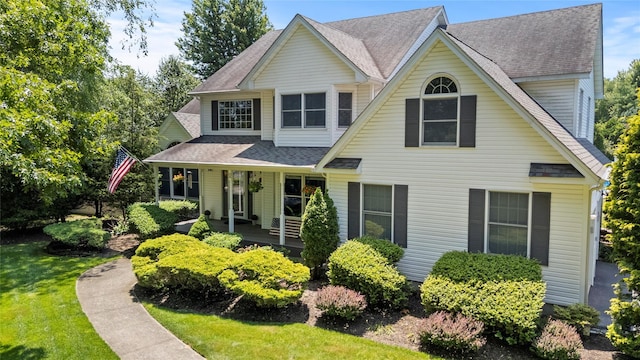 2 Old Brookville Ct, Manorville, NY 11949 - view of front facade with a front yard and a shingled roof