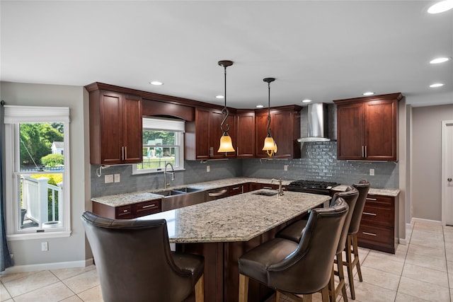 2 Old Brookville Ct, Manorville, NY 11949 - kitchen with wall chimney exhaust hood, light tile patterned flooring, a center island with sink, decorative backsplash, and recessed lighting