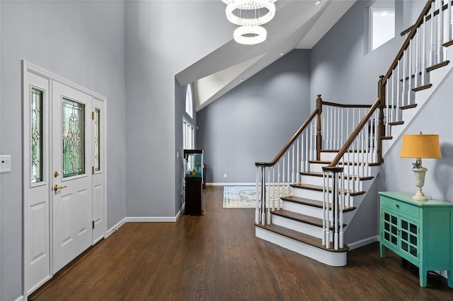 2 Old Brookville Ct, Manorville, NY 11949 - foyer entrance with high vaulted ceiling, stairway, wood finished floors, and a chandelier