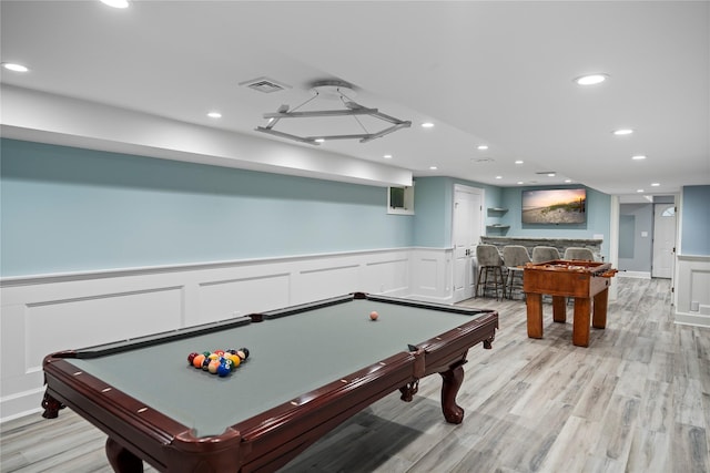 2 Old Brookville Ct, Manorville, NY 11949 - playroom featuring billiards, a wainscoted wall, recessed lighting, light wood-style floors, and a decorative wall