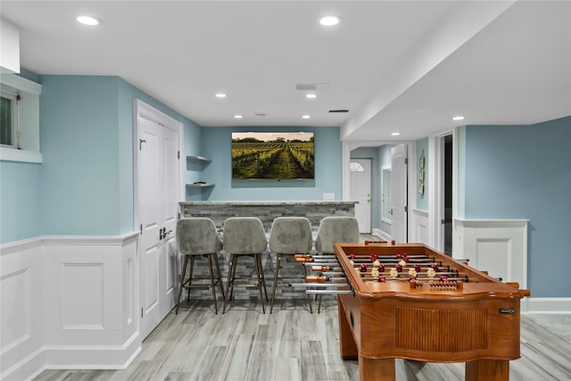 2 Old Brookville Ct, Manorville, NY 11949 - game room with wood finished floors, wainscoting, recessed lighting, and bar area