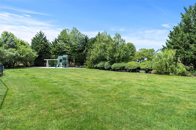 2 Old Brookville Ct, Manorville, NY 11949 - view of green lawn featuring a playground