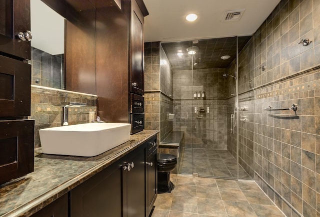 135 Ocean Ave, Massapequa, NY 11758 - full bath with a tile shower, vanity, toilet, tile walls, and recessed lighting