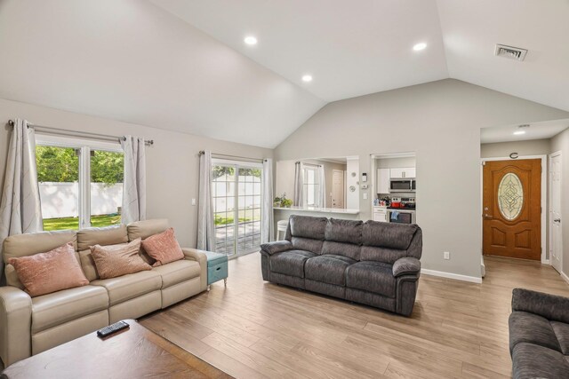 70 Propose Rd, Shirley, NY 11967 - living room with light wood-type flooring, lofted ceiling, recessed lighting, and baseboards