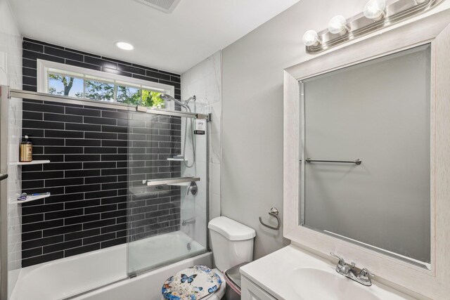 70 Propose Rd, Shirley, NY 11967 - full bath with toilet, vanity, and bath / shower combo with glass door
