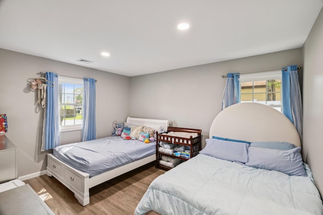 70 Propose Rd, Shirley, NY 11967 - bedroom featuring multiple windows, wood finished floors, recessed lighting, and baseboards