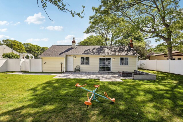 70 Propose Rd, Shirley, NY 11967 - back of house featuring a patio area and a chimney