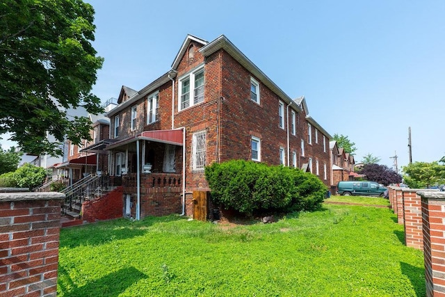 1681 Brooklyn Ave, Brooklyn, NY 11210 - view of home's exterior featuring a yard and brick siding