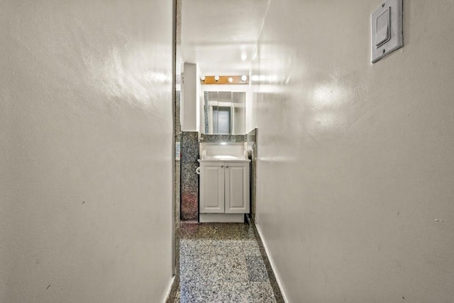 1681 Brooklyn Ave, Brooklyn, NY 11210 - corridor with baseboards and speckled floor