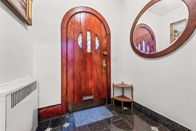 1681 Brooklyn Ave, Brooklyn, NY 11210 - entrance foyer featuring granite floors, baseboards, and radiator heating unit
