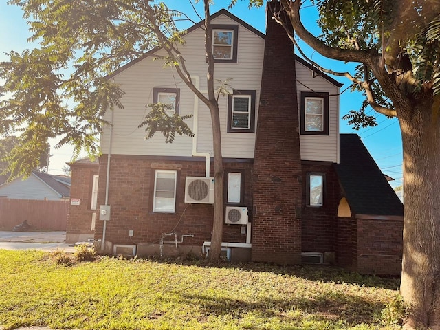 21 James Ll Burrell Ave, Hempstead, NY 11550 - view of front of property with ac unit and brick siding