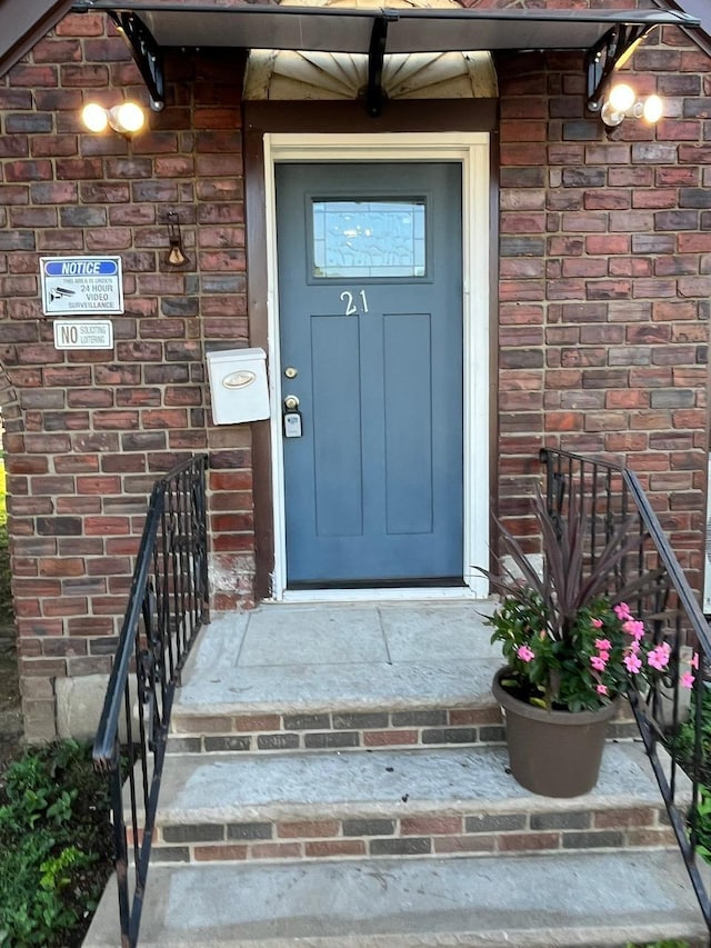 21 James Ll Burrell Ave, Hempstead, NY 11550 - view of exterior entry featuring brick siding