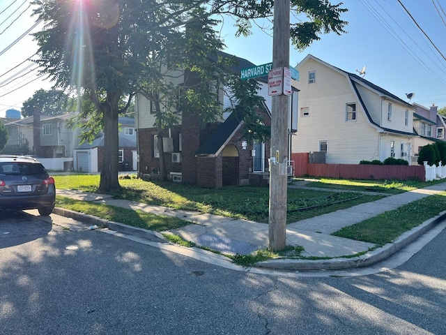 21 James Ll Burrell Ave, Hempstead, NY 11550 - view of side of property featuring a residential view and brick siding