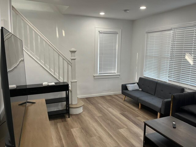 21 James Ll Burrell Ave, Hempstead, NY 11550 - living room featuring wood finished floors, recessed lighting, stairway, and baseboards