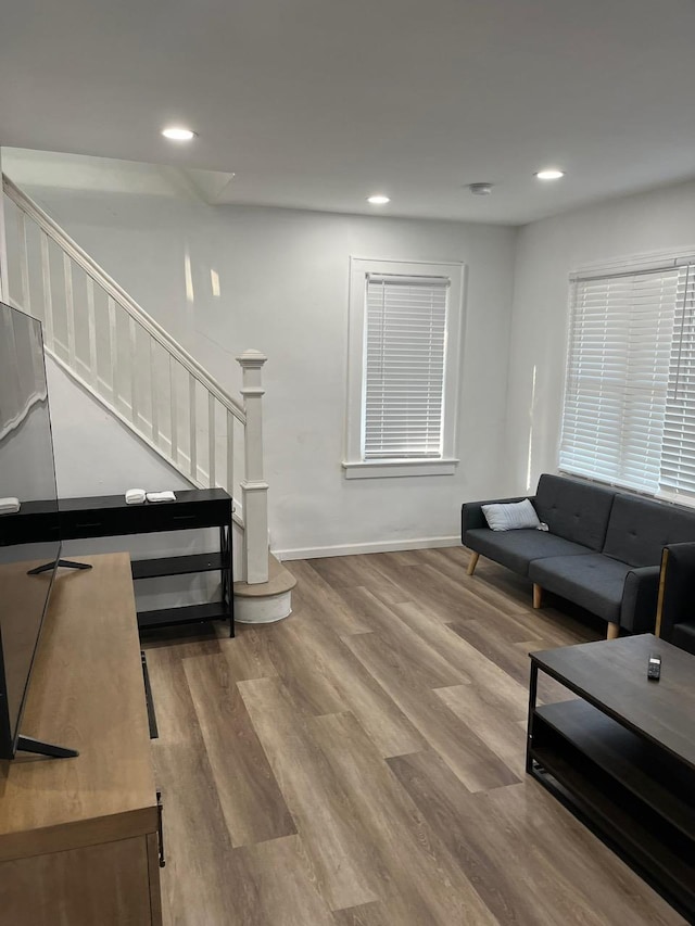 21 James Ll Burrell Ave, Hempstead, NY 11550 - living room with wood finished floors, stairway, recessed lighting, and baseboards