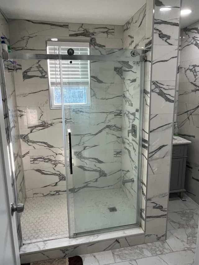 21 James Ll Burrell Ave, Hempstead, NY 11550 - full bathroom featuring a marble finish shower and vanity