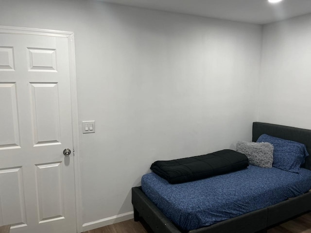 21 James Ll Burrell Ave, Hempstead, NY 11550 - bedroom featuring wood finished floors and baseboards