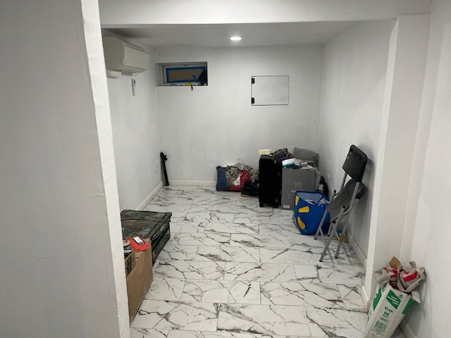 21 James Ll Burrell Ave, Hempstead, NY 11550 - below grade area featuring marble look tiles, a wall unit AC, and recessed lighting