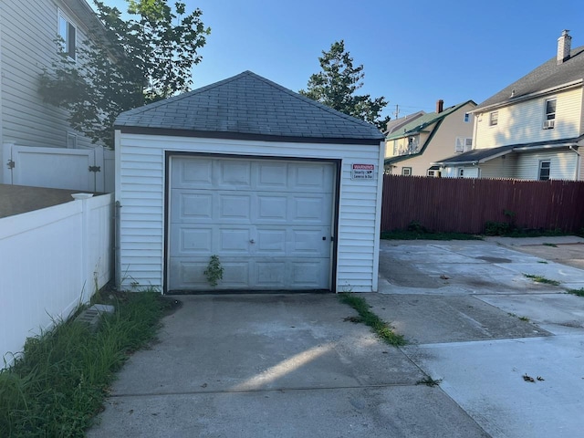 21 James Ll Burrell Ave, Hempstead, NY 11550 - detached garage featuring concrete driveway