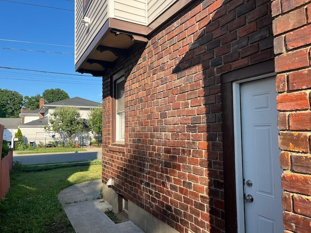 21 James Ll Burrell Ave, Hempstead, NY 11550 - view of property exterior featuring brick siding