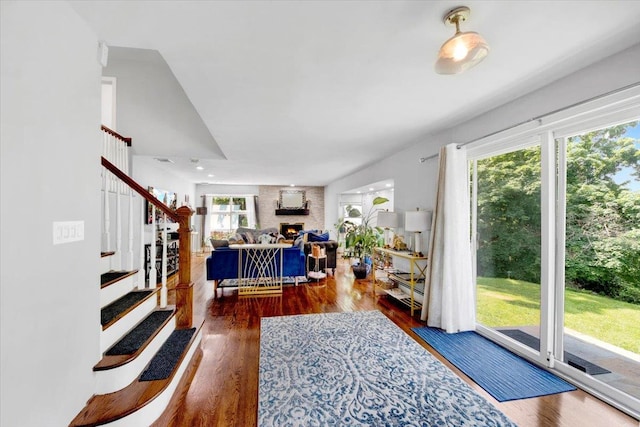 1223 Weaver St, New Rochelle, NY 10804 - foyer entrance featuring stairway, a large fireplace, and wood finished floors