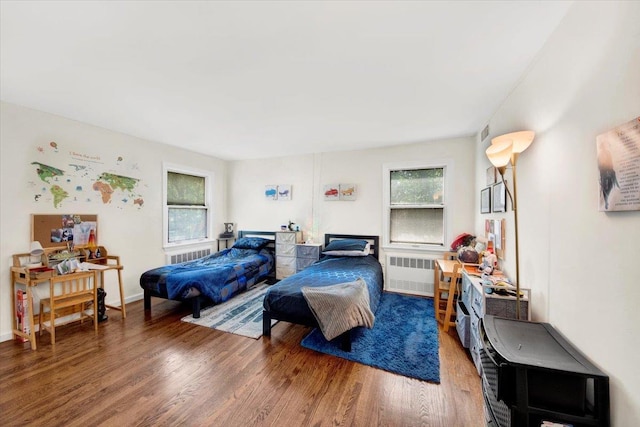 1223 Weaver St, New Rochelle, NY 10804 - bedroom with radiator and wood finished floors