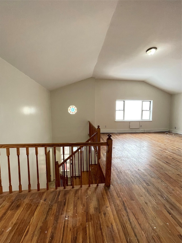 2110 Light St, Bronx, NY 10466 - staircase featuring vaulted ceiling, hardwood / wood-style floors, and baseboards
