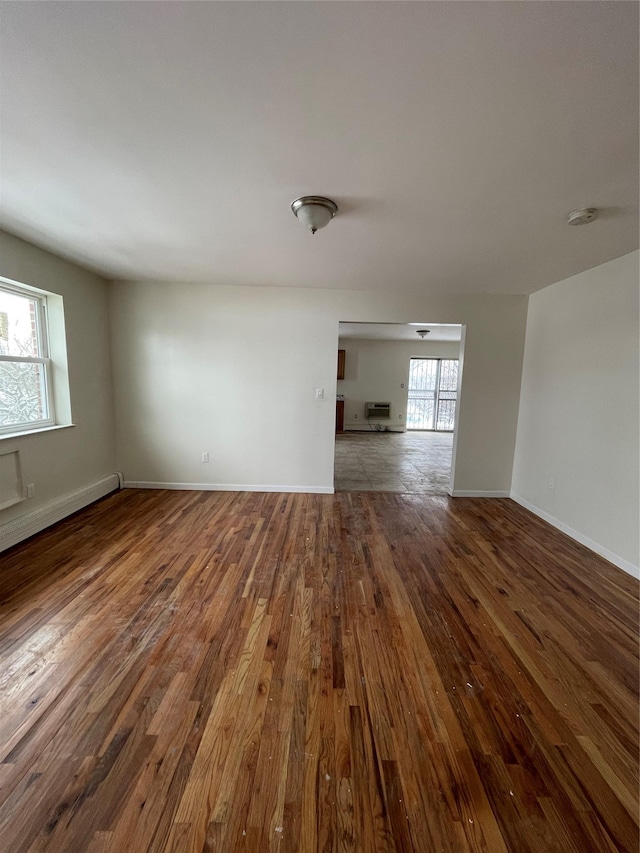 2110 Light St, Bronx, NY 10466 - spare room featuring hardwood / wood-style flooring, baseboards, baseboard heating, and a smoke detector