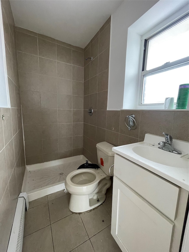 2110 Light St, Bronx, NY 10466 - bathroom with tile walls, toilet, a baseboard heating unit, tile patterned floors, and a stall shower