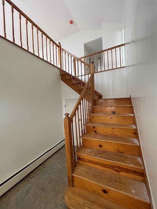 2110 Light St, Bronx, NY 10466 - stairs with baseboard heating, concrete floors, and high vaulted ceiling