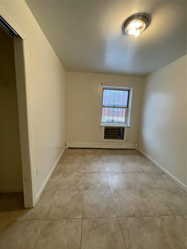 2110 Light St, Bronx, NY 10466 - tiled empty room featuring baseboards, a baseboard heating unit, and a wall mounted air conditioner