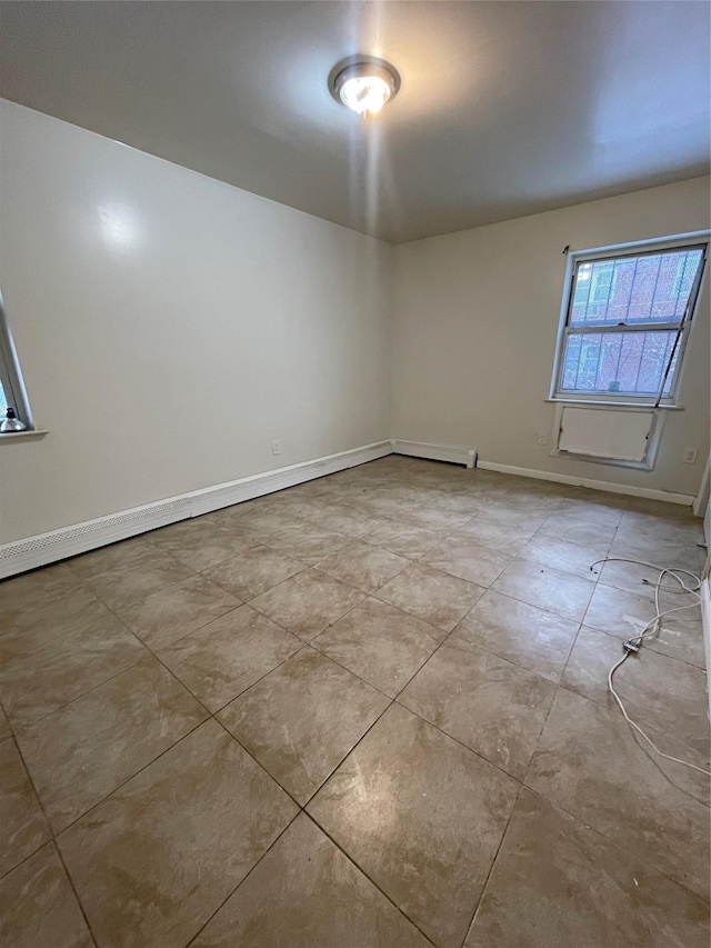 2110 Light St, Bronx, NY 10466 - tiled empty room with baseboards