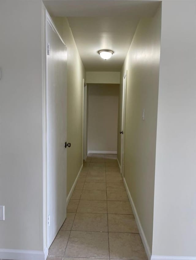2110 Light St, Bronx, NY 10466 - hall featuring light tile patterned flooring and baseboards