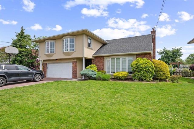 654 Derby Ave, Woodmere, NY 11598 - view of front of home with a chimney, a garage, driveway, brick siding, and stucco siding