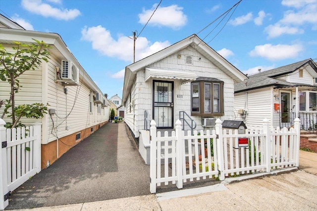 611 Clarence Ave, Bronx, NY 10465 - shotgun-style home with a fenced front yard